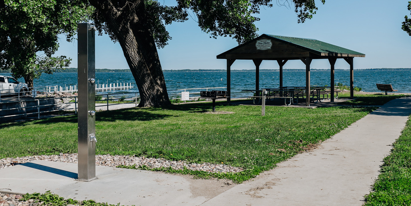 City of Orleans 2 A picnic area with a tree and a bench in Orleans, Iowa