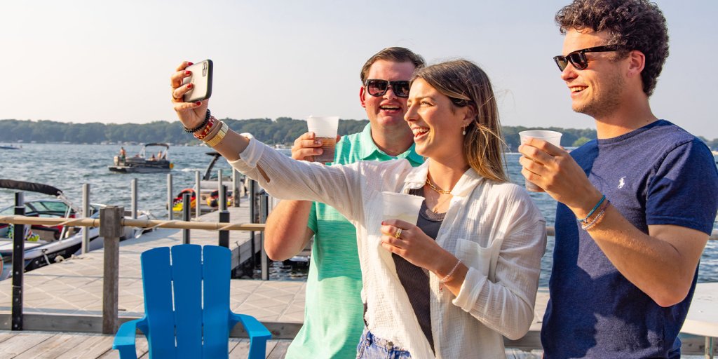 Request an RFP 5 A group of people taking a selfie on a pier.