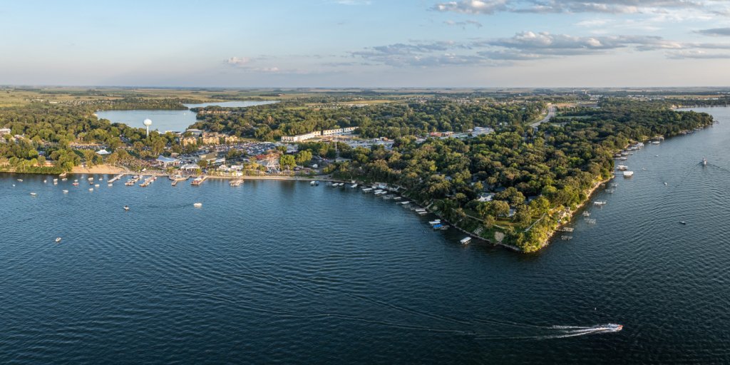 Plan Your Trip 8 A body of water with a city and boats in the summer