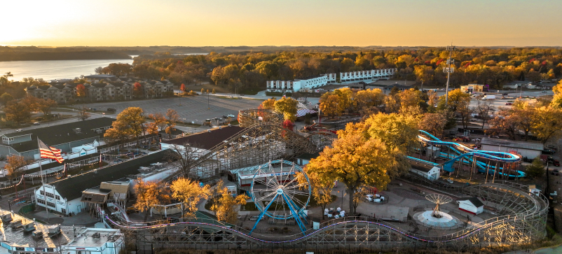 Best Vacay 4 An amusement park with trees and buildings in the fall.