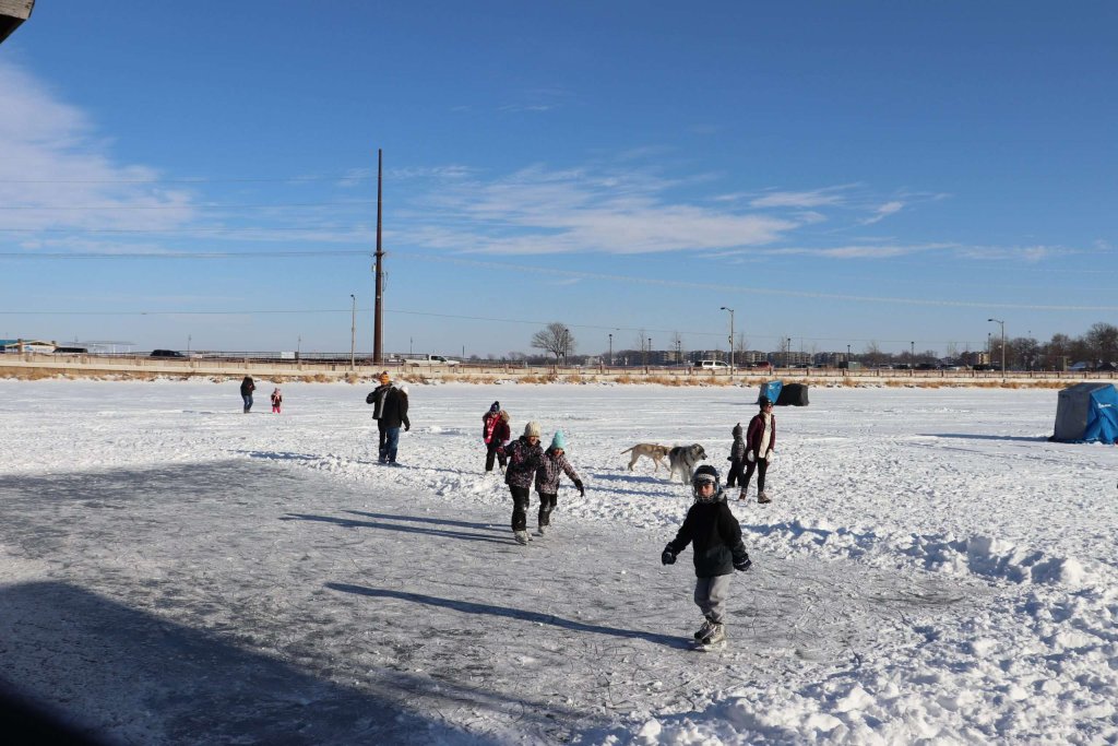 Winter Family Fun in Okoboji 14 kids skating on West Lake Okoboji