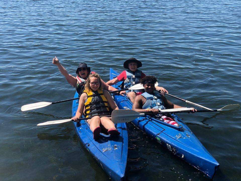 Kayaking in blue kayaks