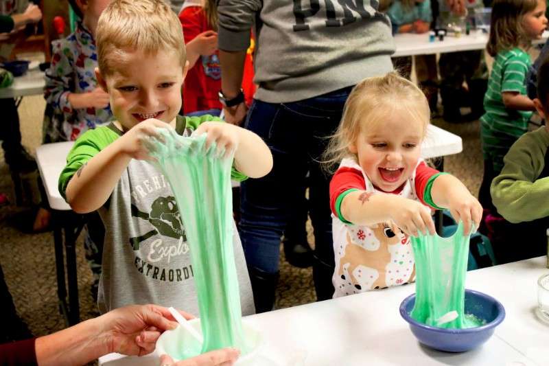 Kids playing with green slime