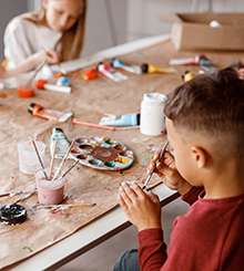 kids painting paper with colorful paints220x245 3