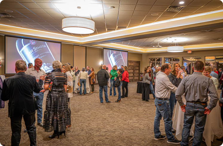 Why Business Retreats in Okoboji are the ultimate event experience 6 A group of people in a networking event at a meeting venue.